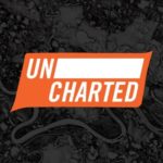Logo for uncharted magazine; white text on orange background over black overlay